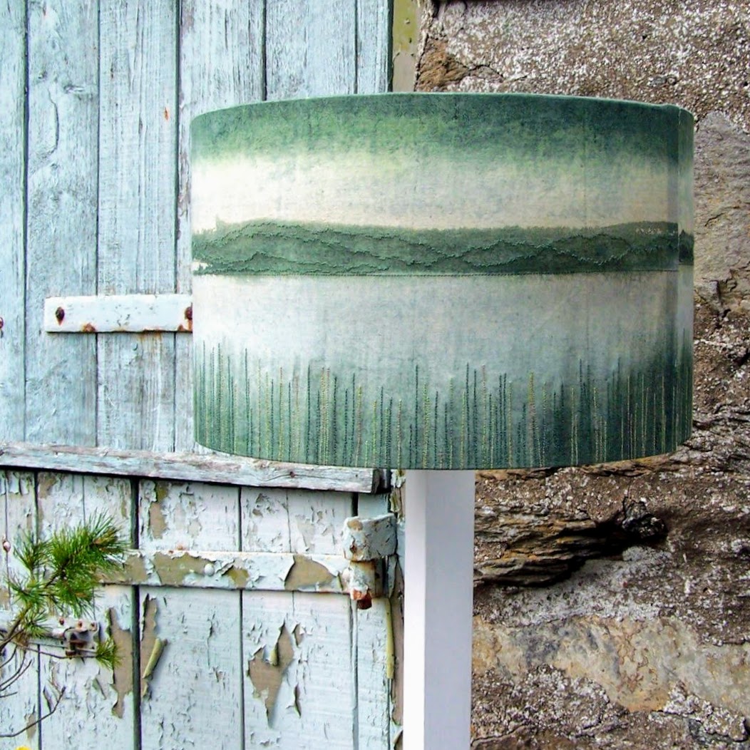handmade lampshade in front of a barn door