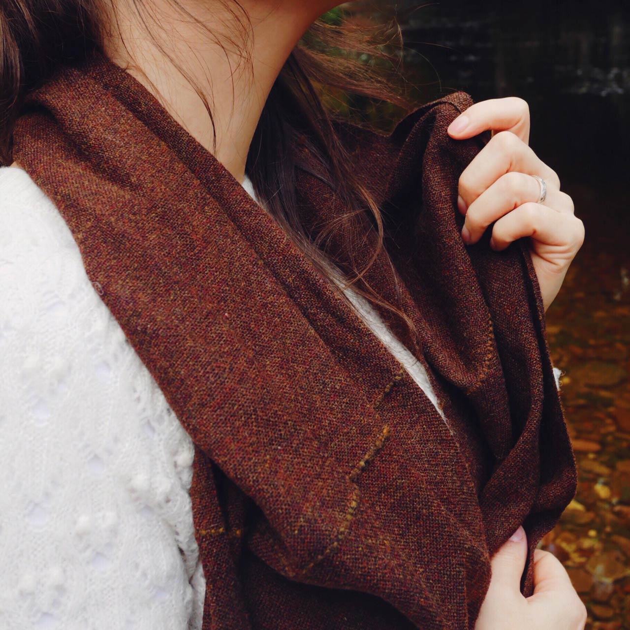 woman wearing a brown scarf
