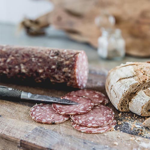 cut venison salami and bread