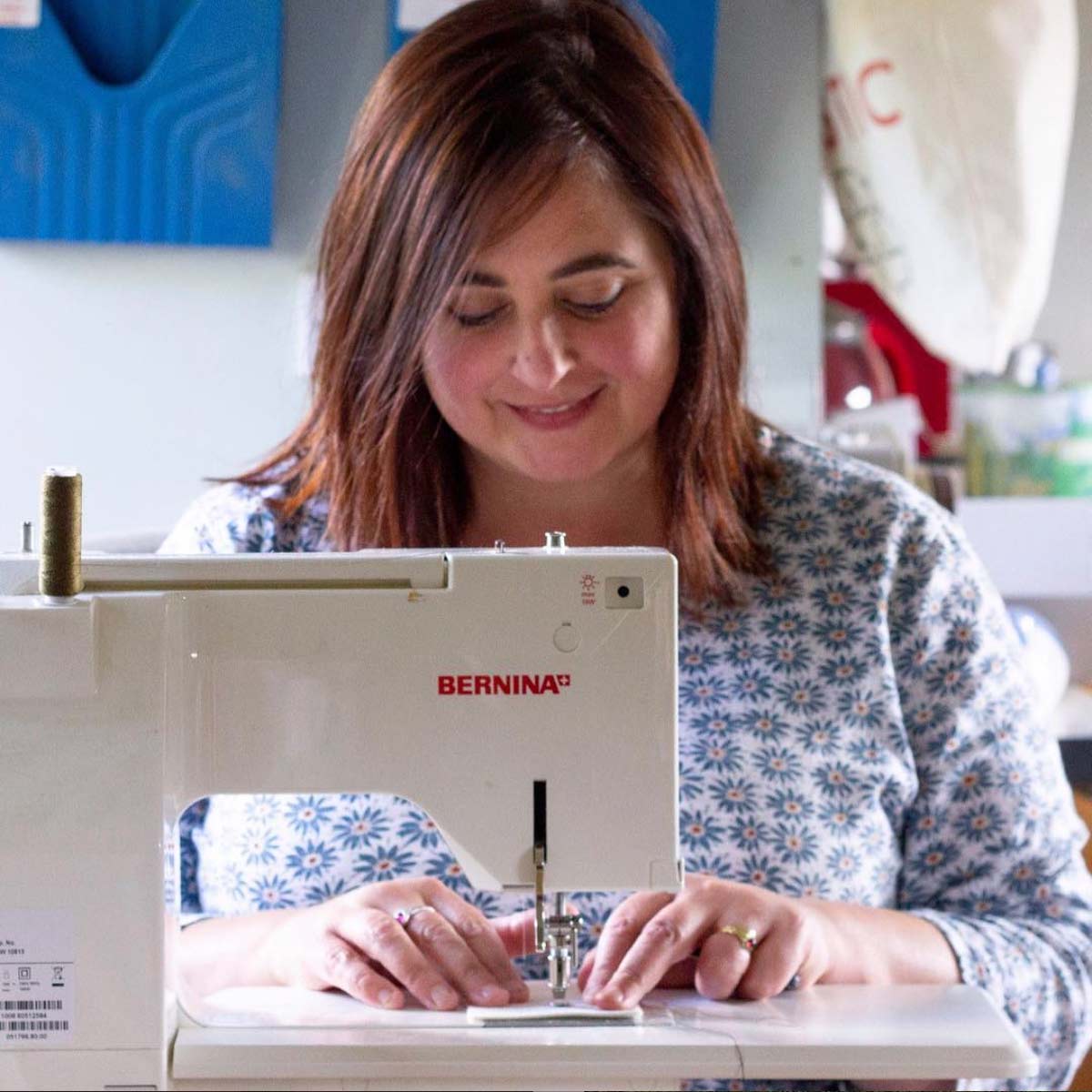 a woman on a bed with a laptop, holding a cup of coffee - next steps to future-proof your small business