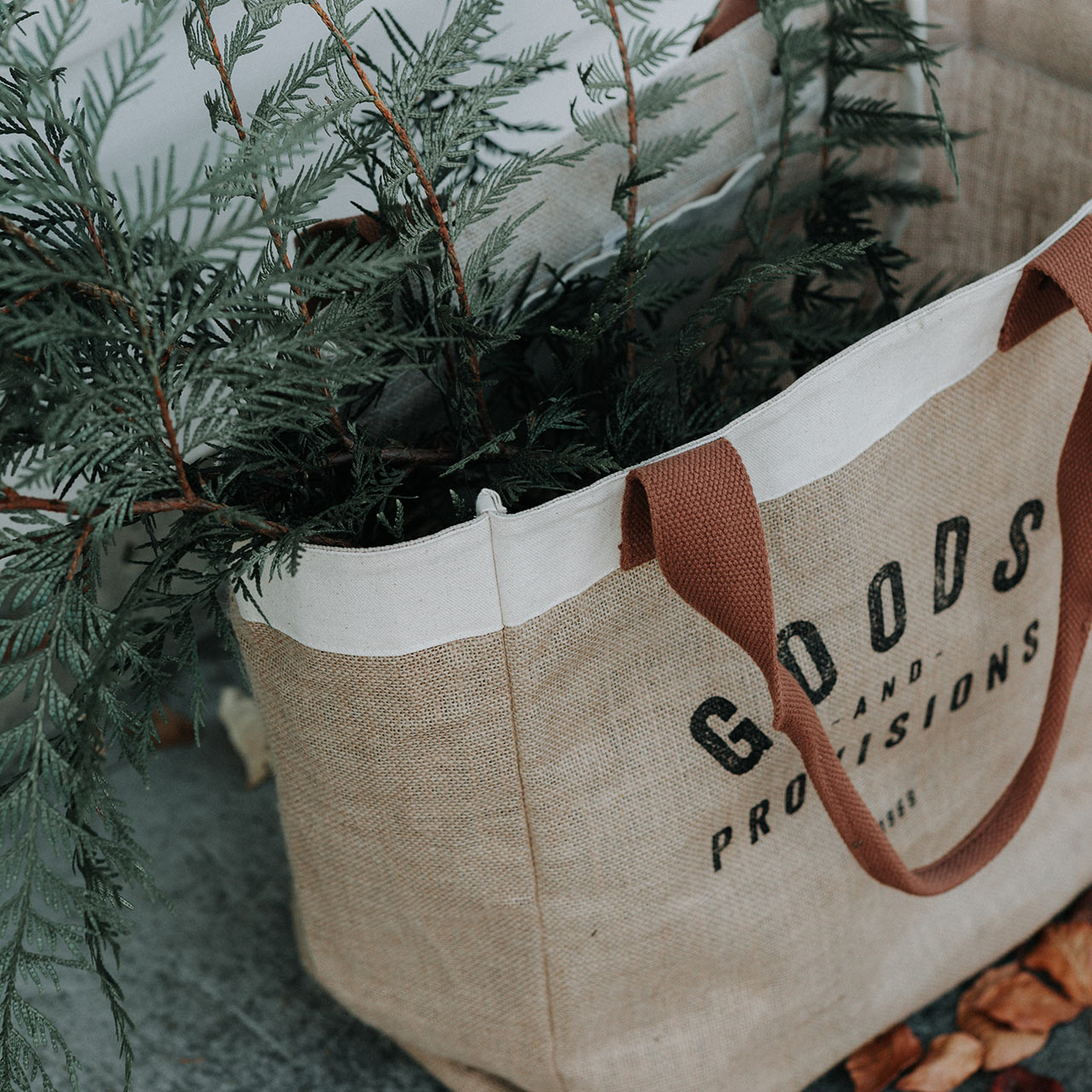 Green Friday - shop sustainable shopping bag with pine branches sticking out - sustainable shopping