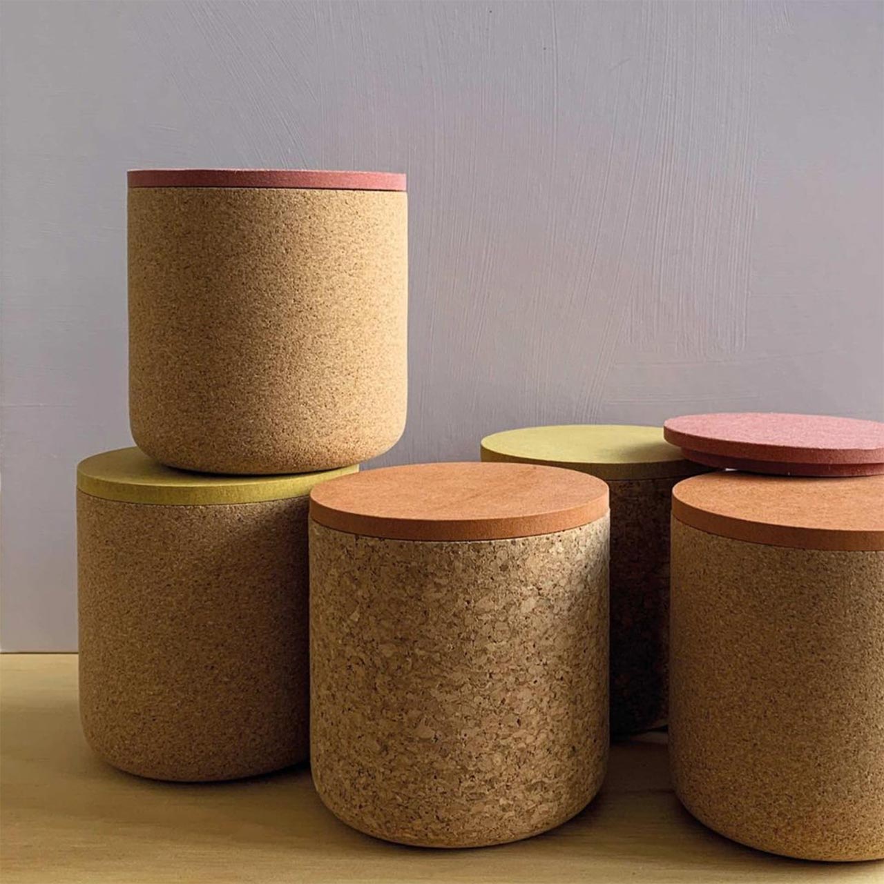 six cork posts with different coloured lids
