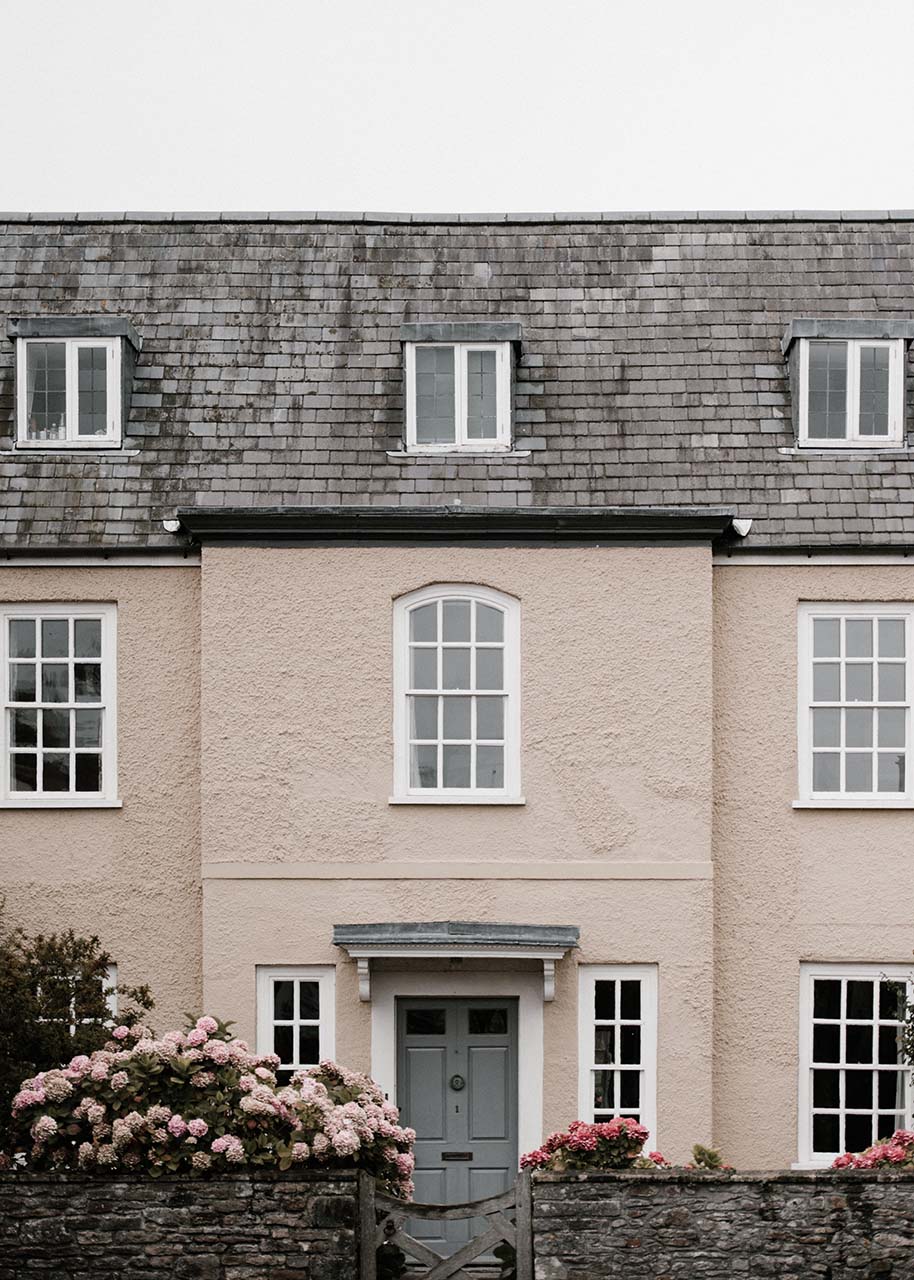 pink home with a slate roof - sustainable home upgrade