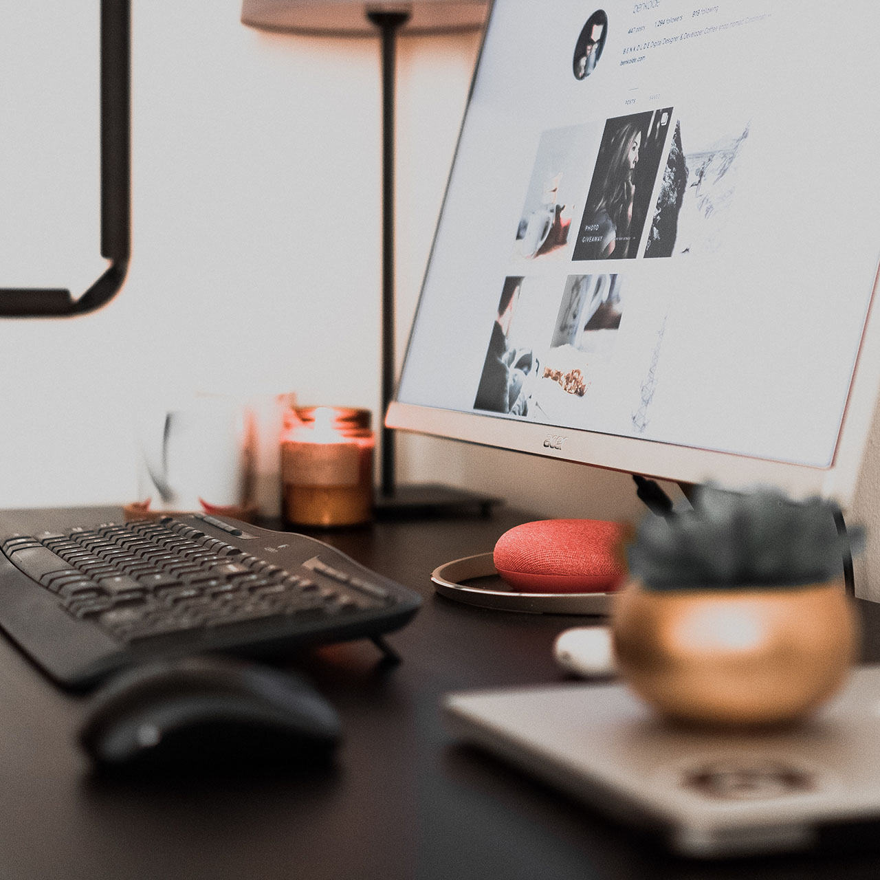 a desk with a lit candle