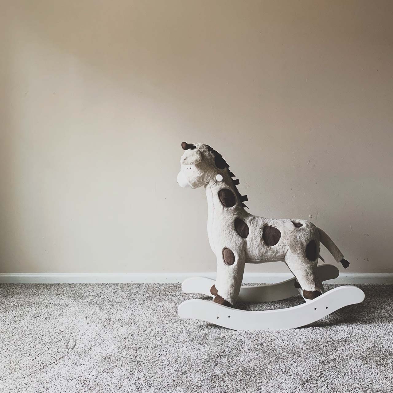 a rocking horse in a children's playroom