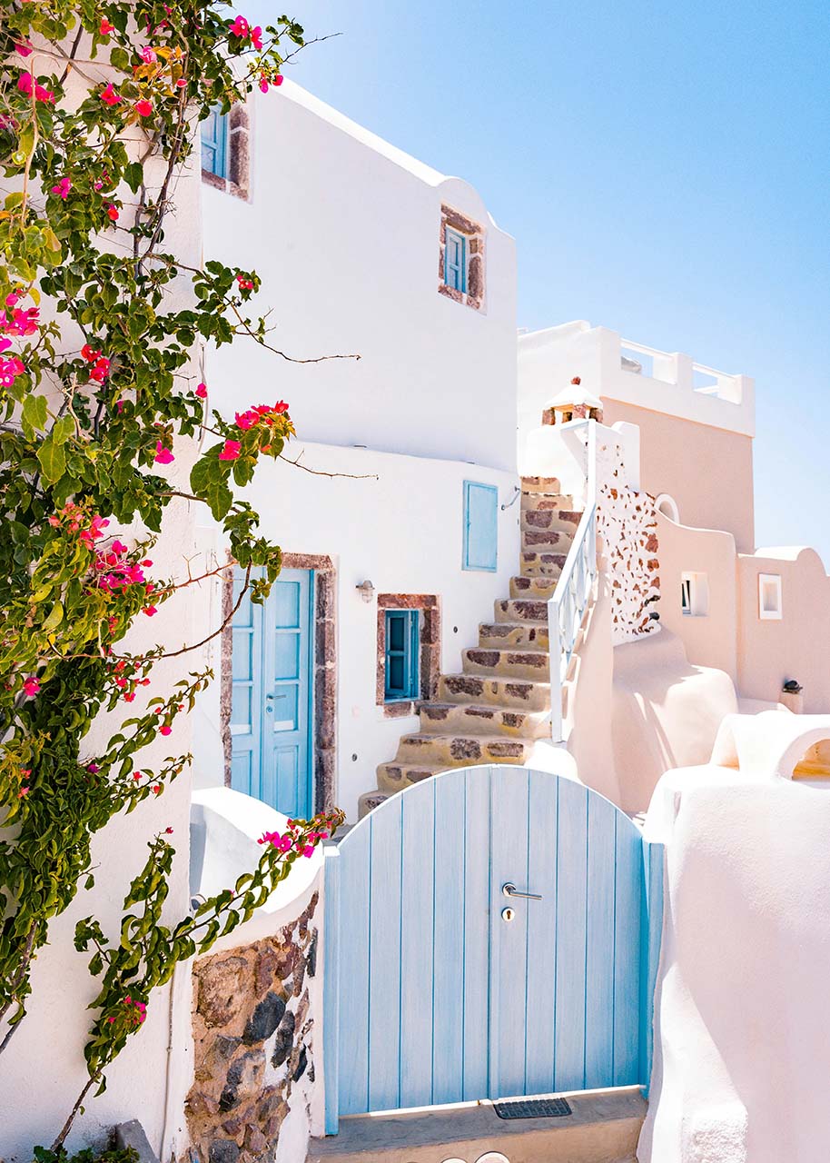 Pastel houses on Santorini - slow travel destinations