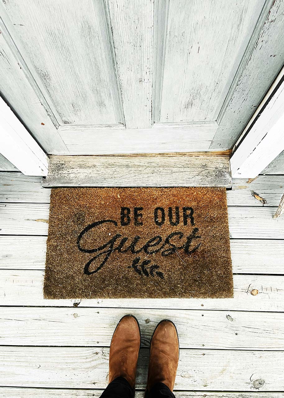 Standard doormat with text reading be our guest