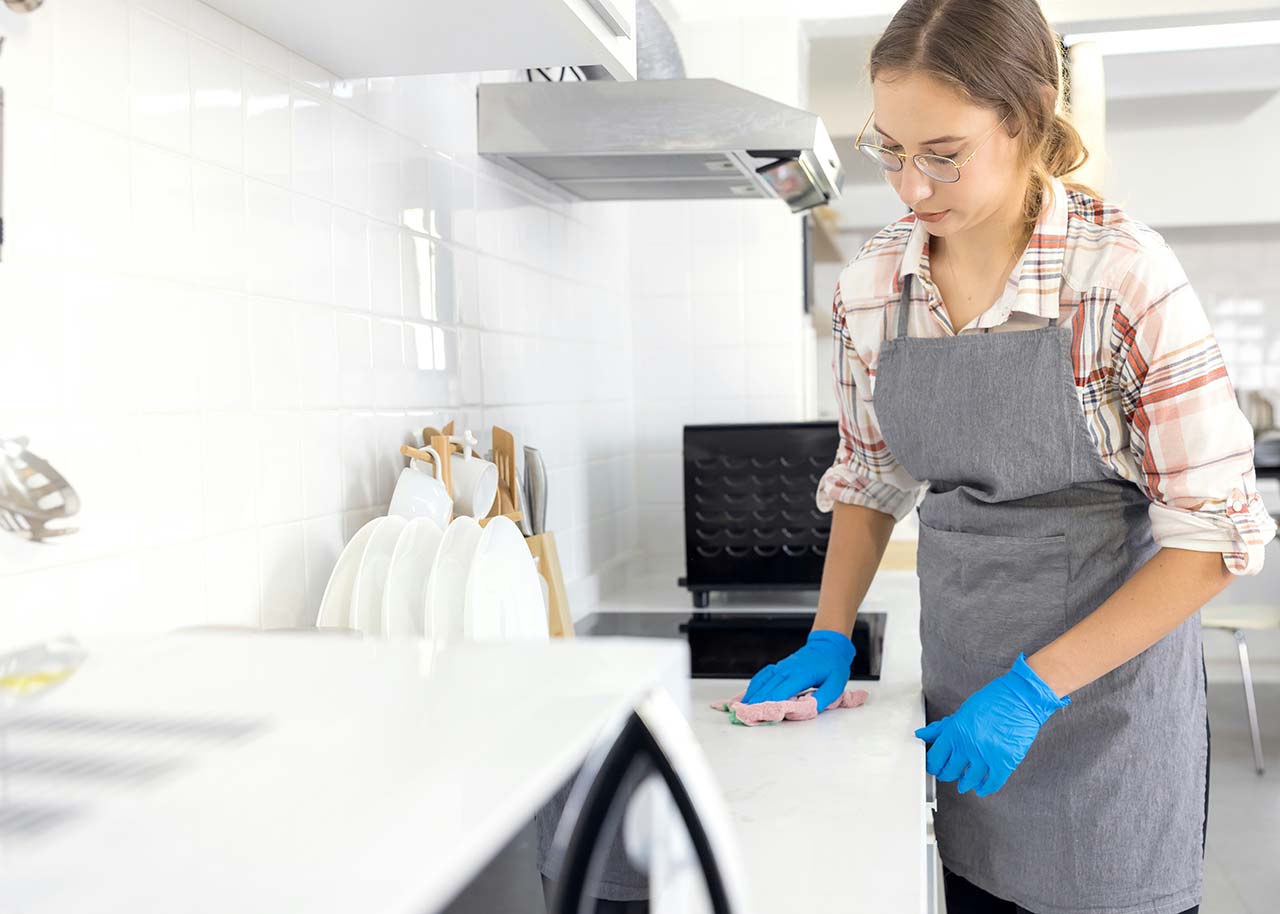 a woman on a bed with a laptop, holding a cup of coffee - next steps to future-proof your small business