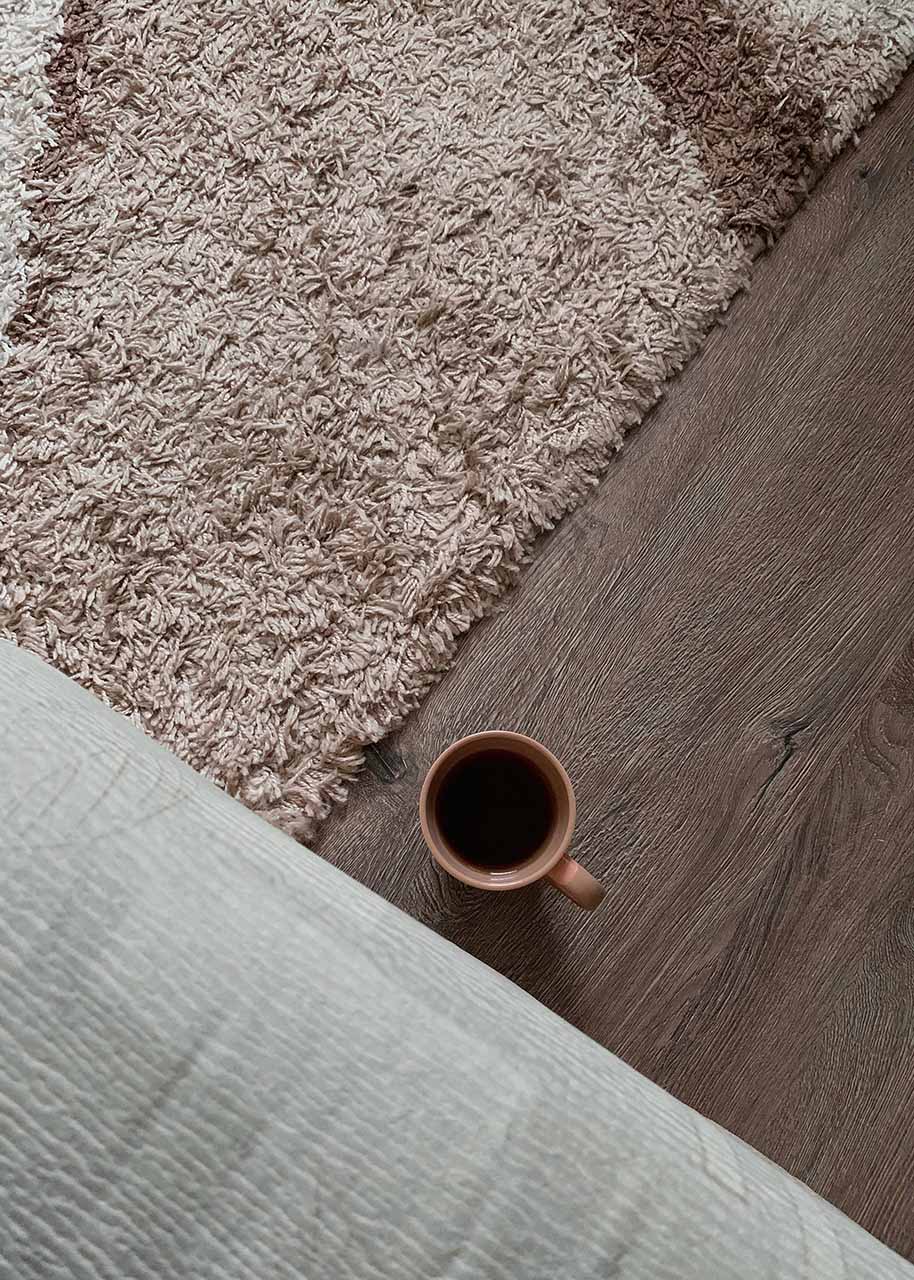 carpet on the floor with a cup of tea